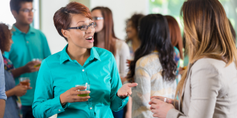 scholars interacting at a group event