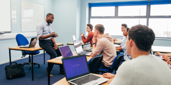 Photo of a person leading a workshop in a classroom