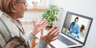 patient speaking to a doctor on a laptop